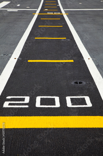 Small runway on the deck of aircraft carrier © meepoohfoto