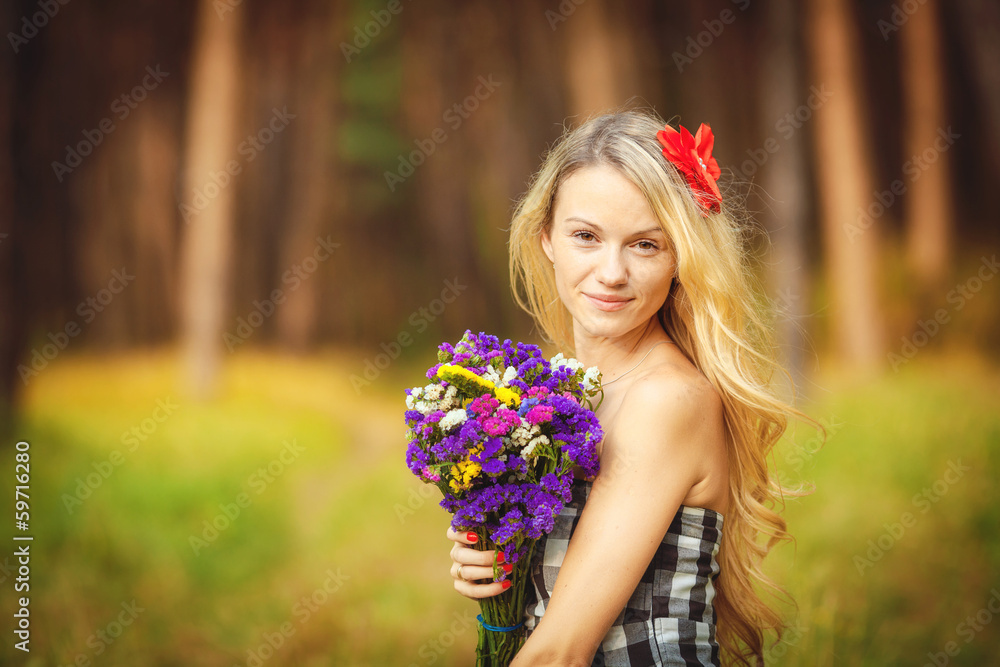 Portrait of a young woman on a background of green nature Portrait of a young woman on a background of green nature