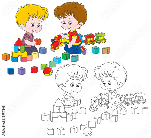 boys playing with a toy train and bricks