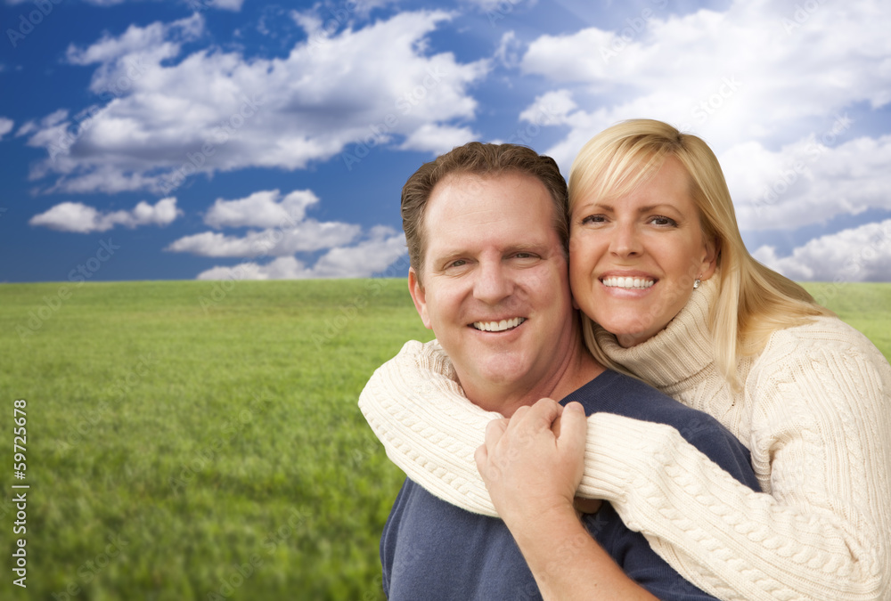 Happy Attractive Couple Hugging at the Park Happy Attractive Couple Hugging at the Park