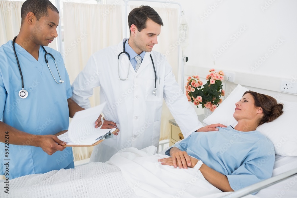 Doctors visiting patient in hospital Doctors visiting patient in hospital