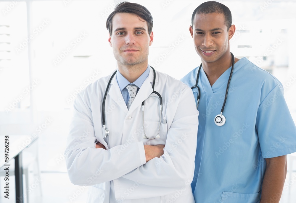 Confident doctors standing together in the hospital Confident doctors standing together in the hospital