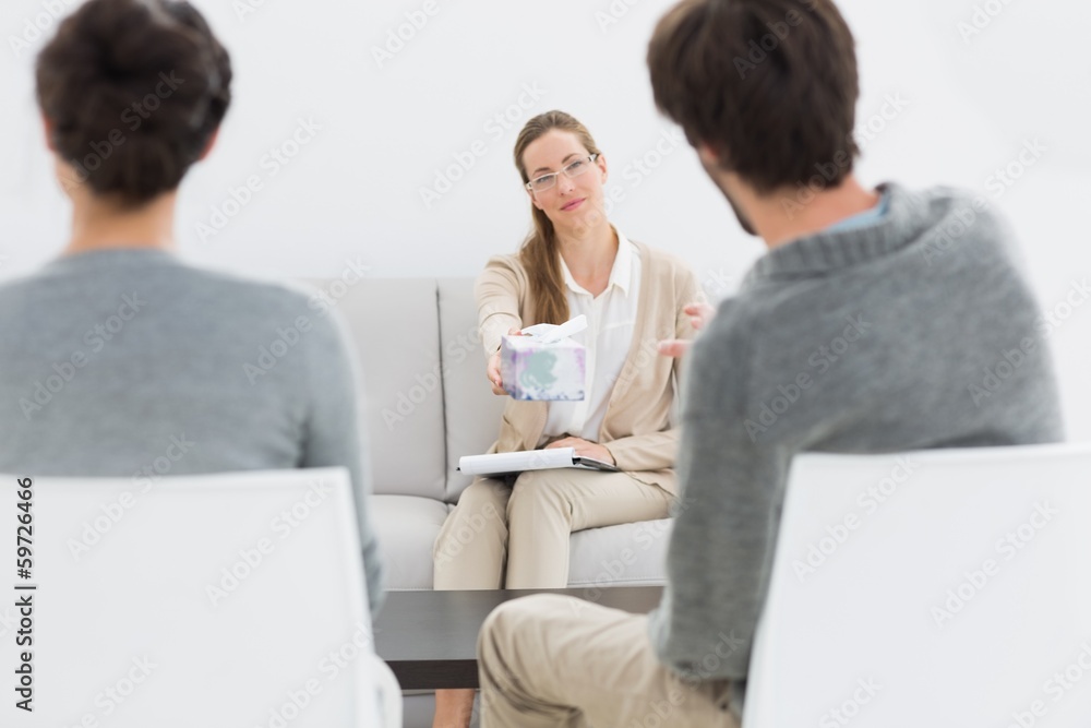 Female financial adviser in meeting with couple Female financial adviser in meeting with couple