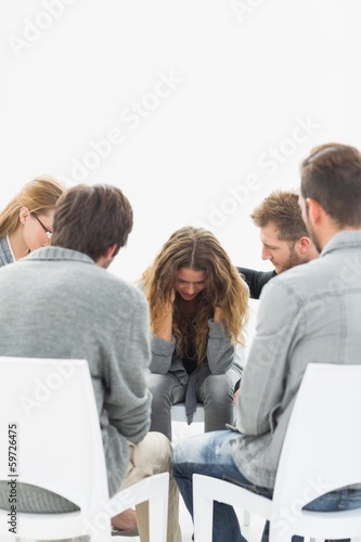 Group therapy in session sitting in a circle