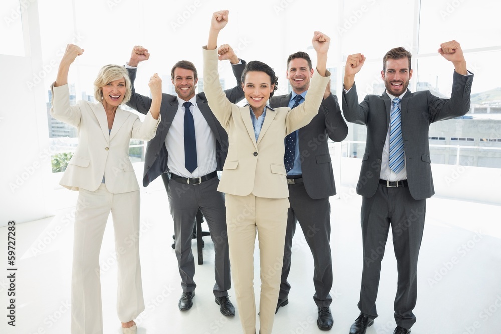 Obraz premium Successful business team clenching fists