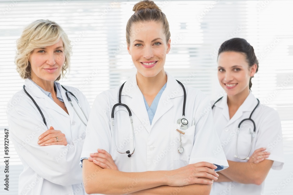 Three confident female doctors with arms crossed Three confident female doctors with arms crossed