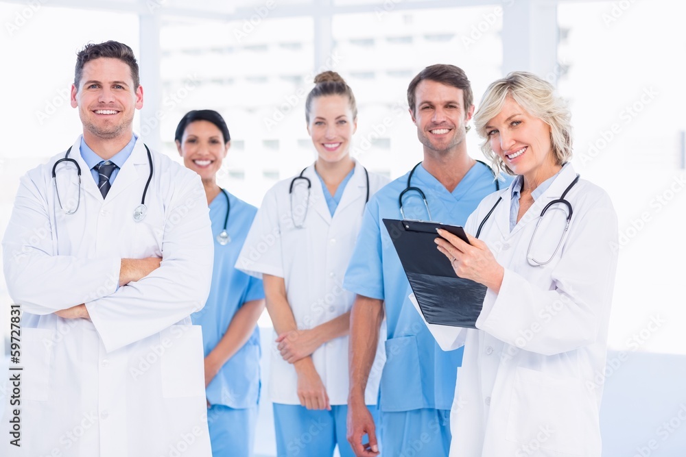 Confident happy group of doctors at medical office Confident happy group of doctors at medical office