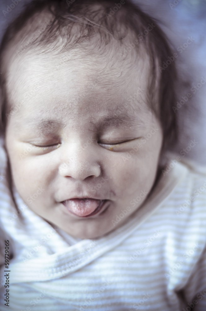 new born baby curled up sleeping on a blanket, multiple expressi new born baby curled up sleeping on a blanket, multiple expressi