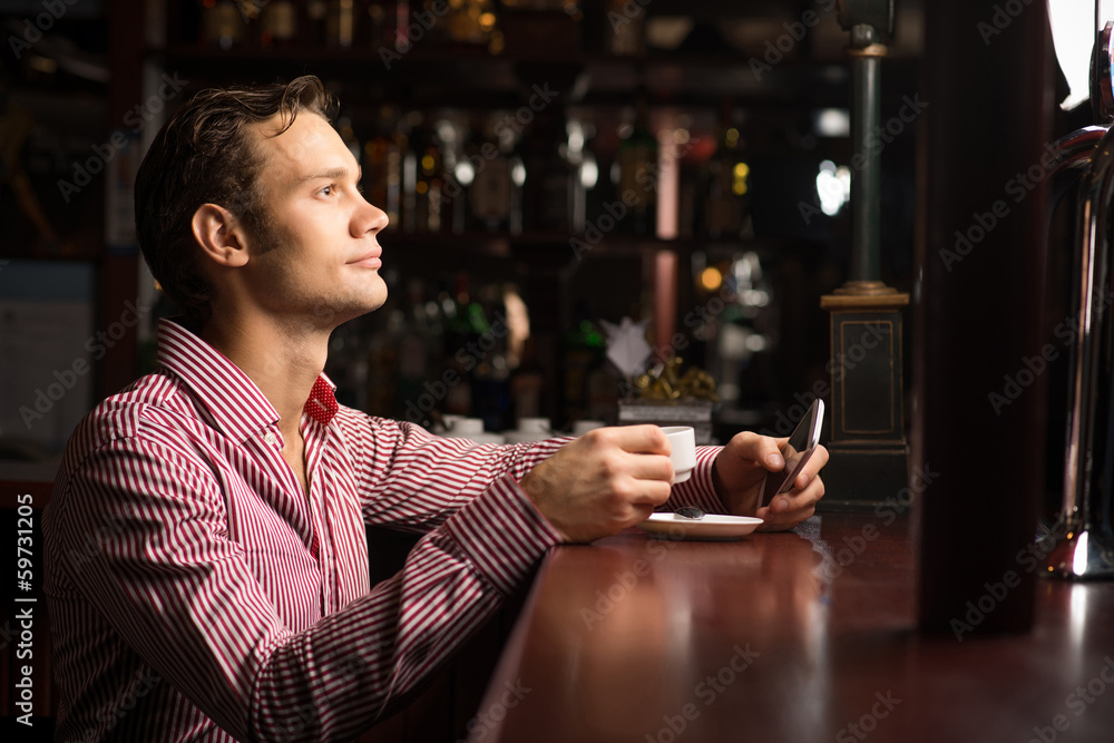 man with a cup of coffee man with a cup of coffee