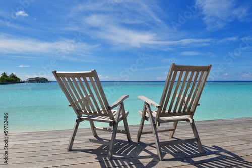 tropical beach chairs © .shock