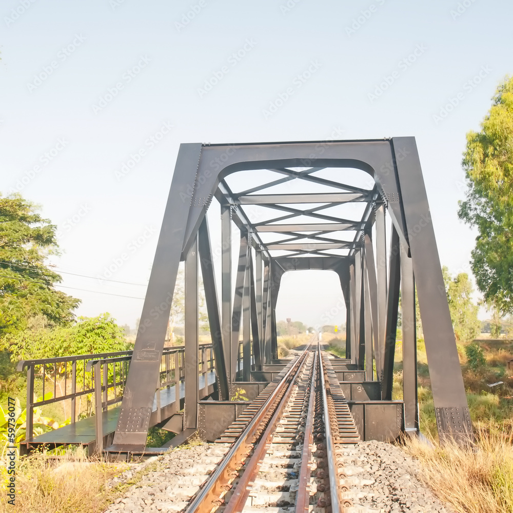Fototapeta premium railway bridge with blue sky in Thailand.