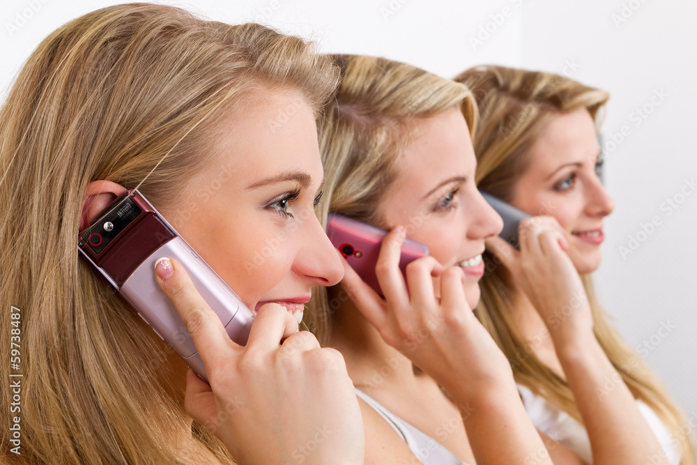 three girls on the mobile phone three girls on the mobile phone