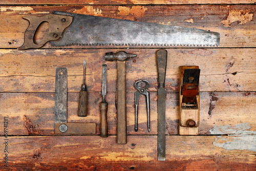 Fotografija old vintage hand tools on wooden background