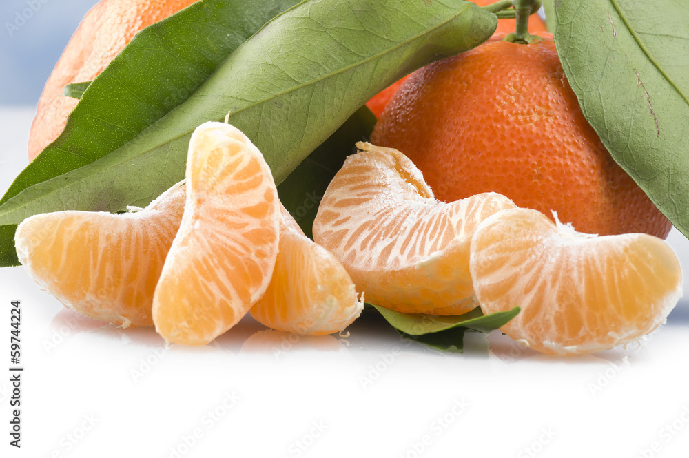 Orange mandarin or tangerine fruit with leaves Orange mandarin or tangerine fruit with leaves