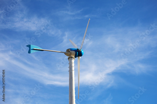 Wind Energy Turbine on Blue Sky Background