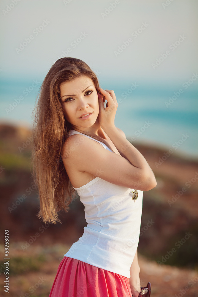 portrait of a woman on a background of mountains and sea portrait of a woman on a background of mountains and sea
