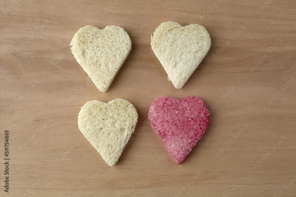 Fototapeta premium Red colored heart shape of bread