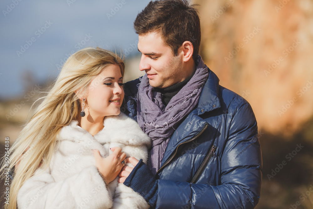 portrait of a young couple on a background of mountains portrait of a young couple on a background of mountains