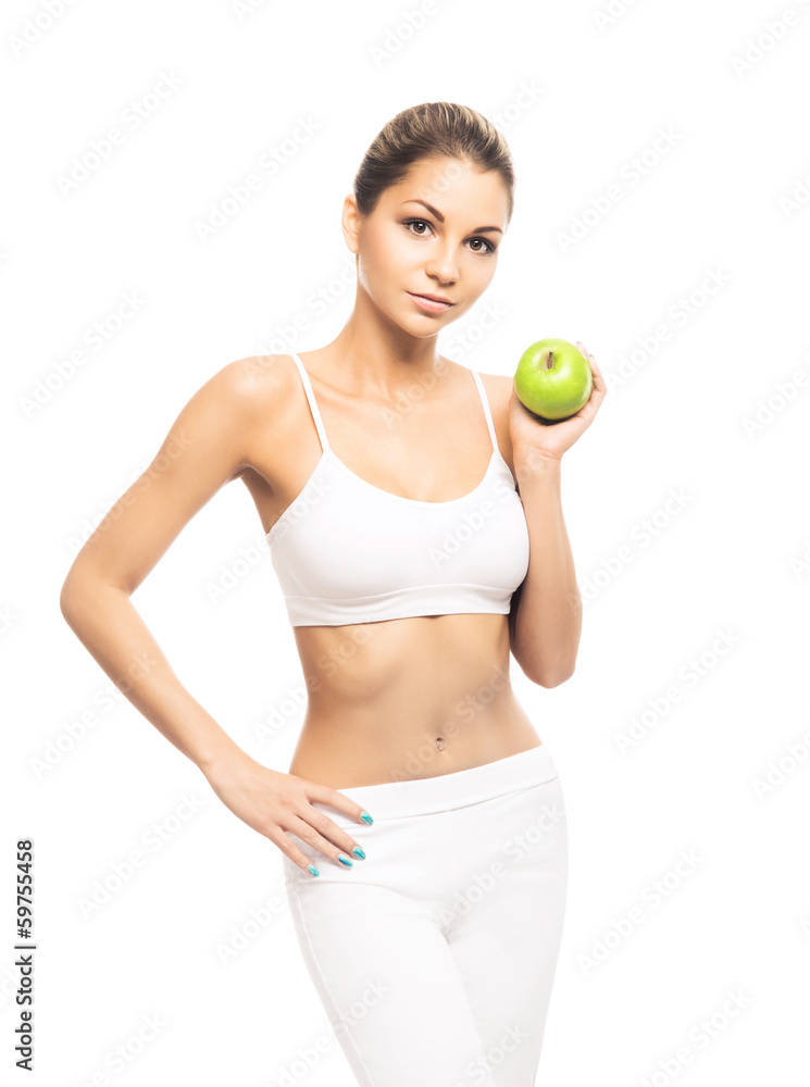 A fit and beautiful girl with an apple isolated on white A fit and beautiful girl with an apple isolated on white