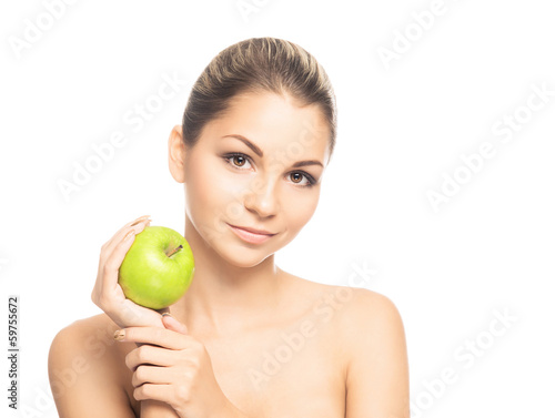 Portrait of a beautiful and sensual girl holding an apple
