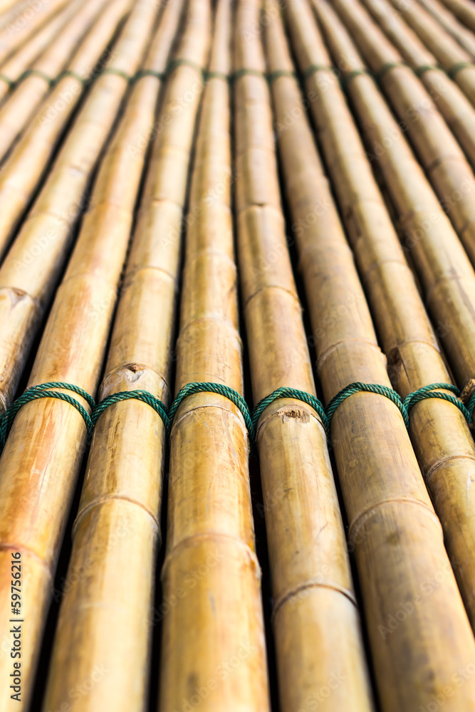Background of bamboo raft with a rope tightly bonded Background of bamboo raft with a rope tightly bonded