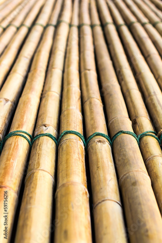 Background of bamboo raft with a rope tightly bonded