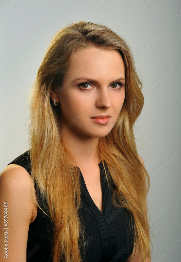 Beauty portrait of young woman in the studio