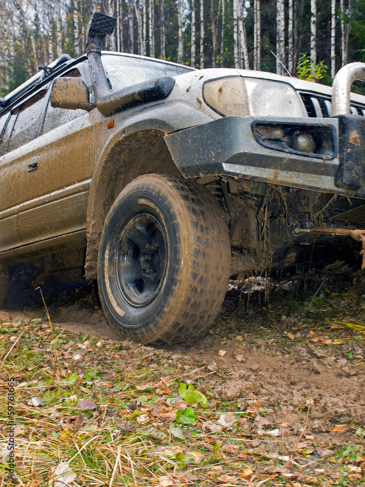 Off-road vehicle with a broken bumper stuck in a swamp. Urals. R Off-road vehicle with a broken bumper stuck in a swamp. Urals. R