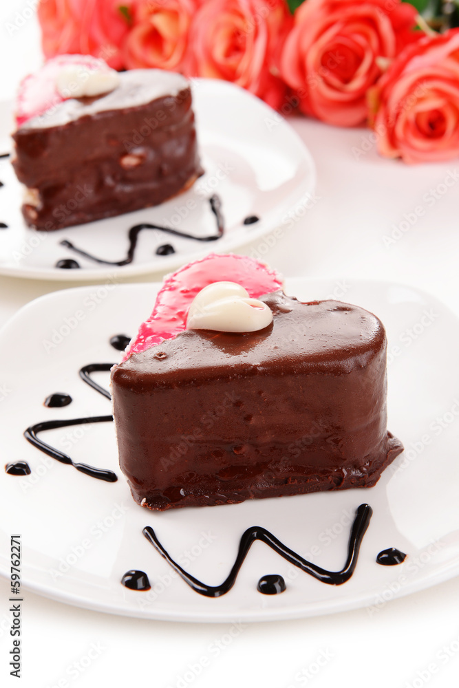 Sweet cakes with chocolate on plate close-up