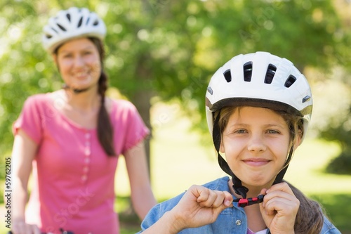 Smiling woman with her daughter riding bicycle © WavebreakmediaMicro