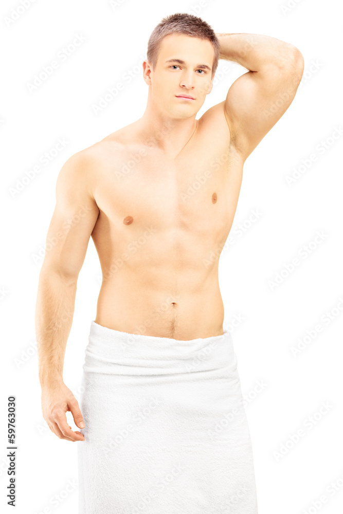 Handsome young man in white towel posing after shower Handsome young man in white towel posing after shower