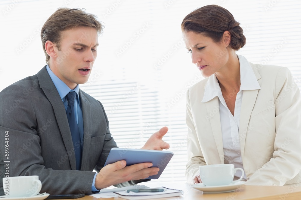 Smartly dressed couple in a business meeting Smartly dressed couple in a business meeting