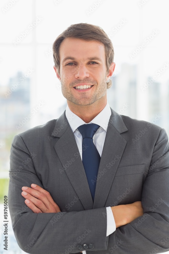 Portrait of a businessman with arms crossed outdoors Portrait of a businessman with arms crossed outdoors