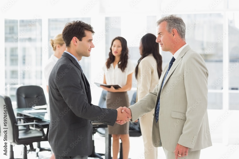 Businessmen meeting and shaking hands