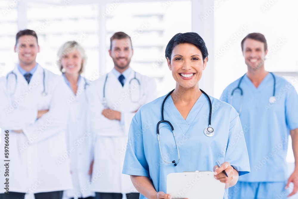 Confident happy group of doctors at medical office Confident happy group of doctors at medical office
