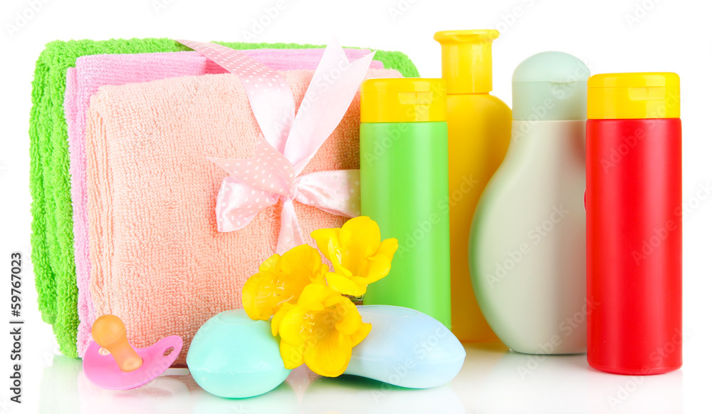 Baby cosmetics, towels and soap, isolated on white Baby cosmetics, towels and soap, isolated on white