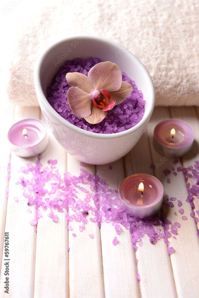 Still life with beautiful blooming orchid flower, towel and Still life with beautiful blooming orchid flower, towel and