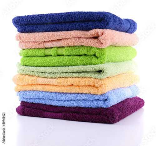 Colorful towels isolated on white © Africa Studio