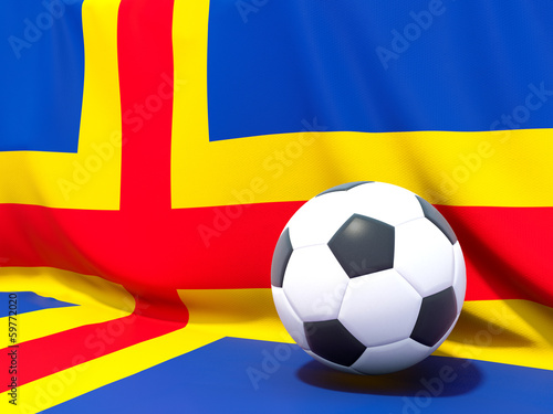 Flag of aland islands with football in front of it
