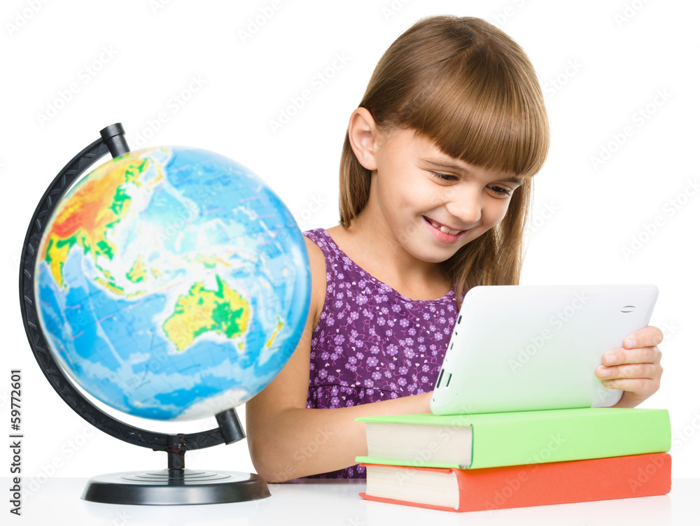 Young girl is using tablet