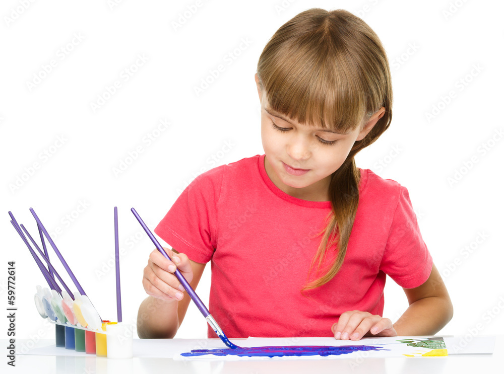 Little girl is painting with gouache Little girl is painting with gouache