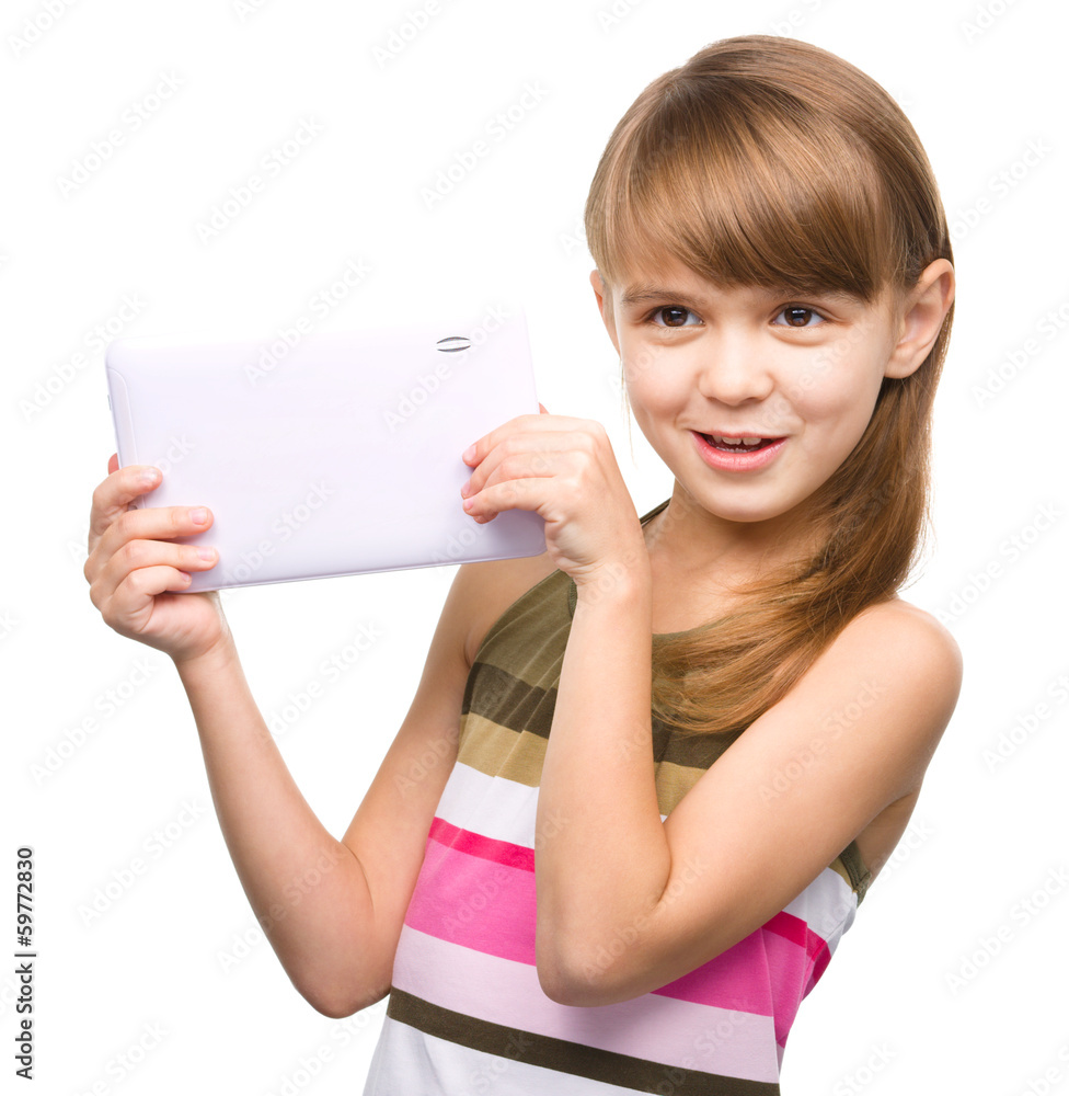 Young girl is using tablet Young girl is using tablet