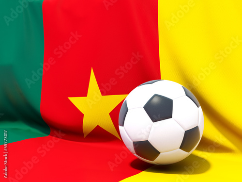 Flag of cameroon with football in front of it