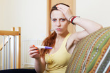 Unhappy girl with pregnancy test