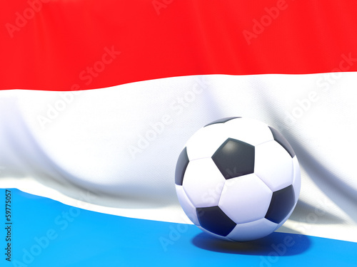 Flag of luxembourg with football in front of it