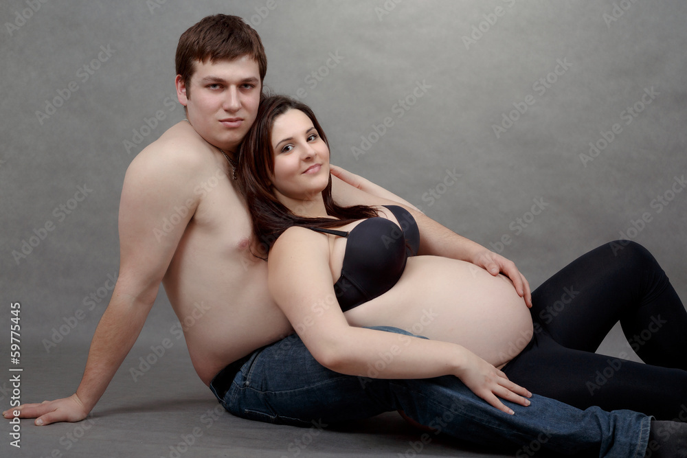 Loving happy couple, pregnant woman with her husband Loving happy couple, pregnant woman with her husband