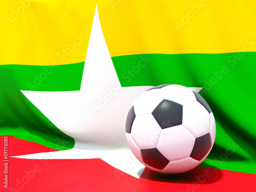 Flag of myanmar with football in front of it