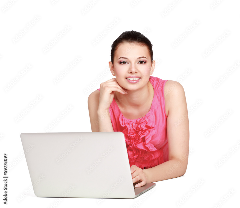 Portrait of beautiful young woman lying on floor with a laptop Portrait of beautiful young woman lying on floor with a laptop
