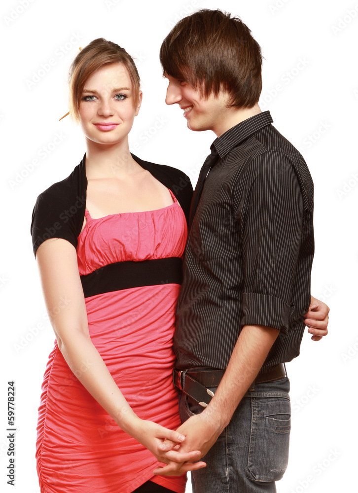 An attractive couple standing isolated on white background An attractive couple standing isolated on white background