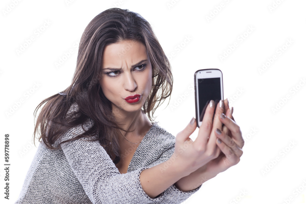 pretty girl make a duck face, and take a self portrait pretty girl make a duck face, and take a self portrait